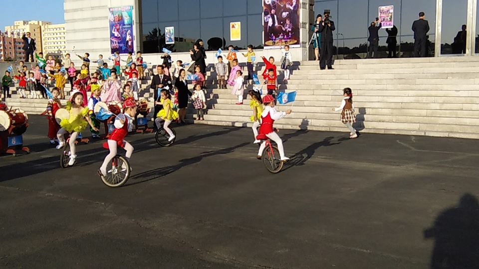 Kids performing unicycle