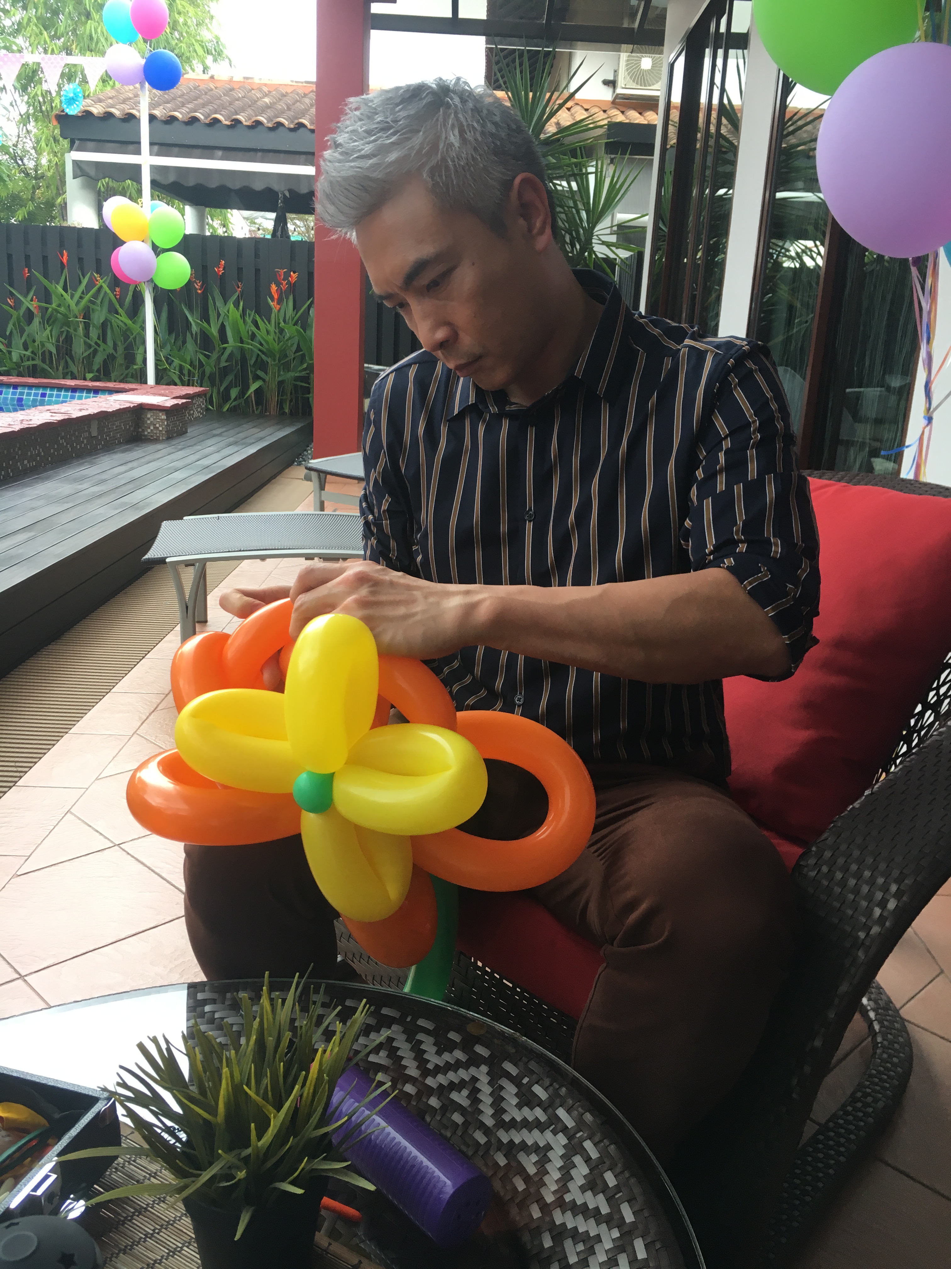 Tay Ping Hui tries to learn balloon sculpting in his free time