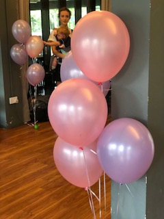 Pink and purple helium balloons