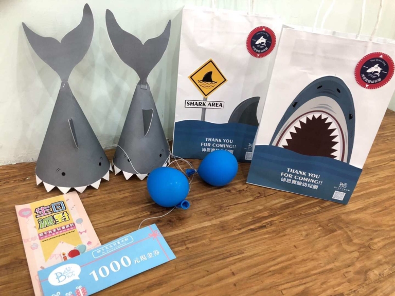 Shark party hat and goodie bags