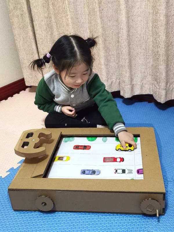 girl playing the DIY racing car game