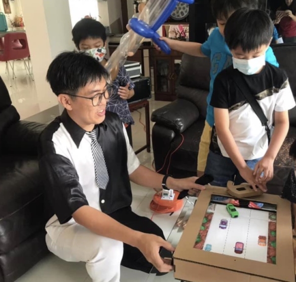 kids playing with the cardboard craft