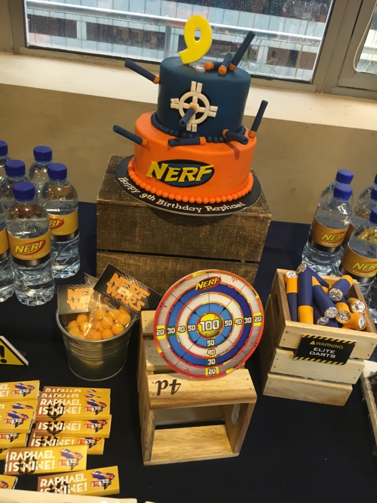 nerf gun cake and dessert table